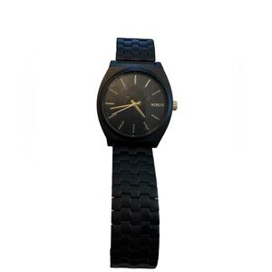 Nixon Black and Gold Timepiece